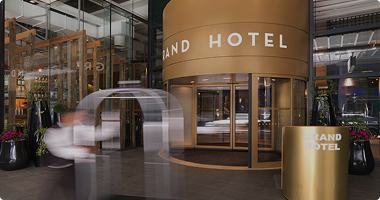 Hotel revolving door with modern glass design